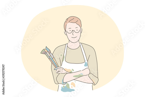 Artist, painter, artwork, drawing concept. Young man artist cartoon character standing in coloured apron and holding heap of painting brushes for making artwork or during workshop in art school 