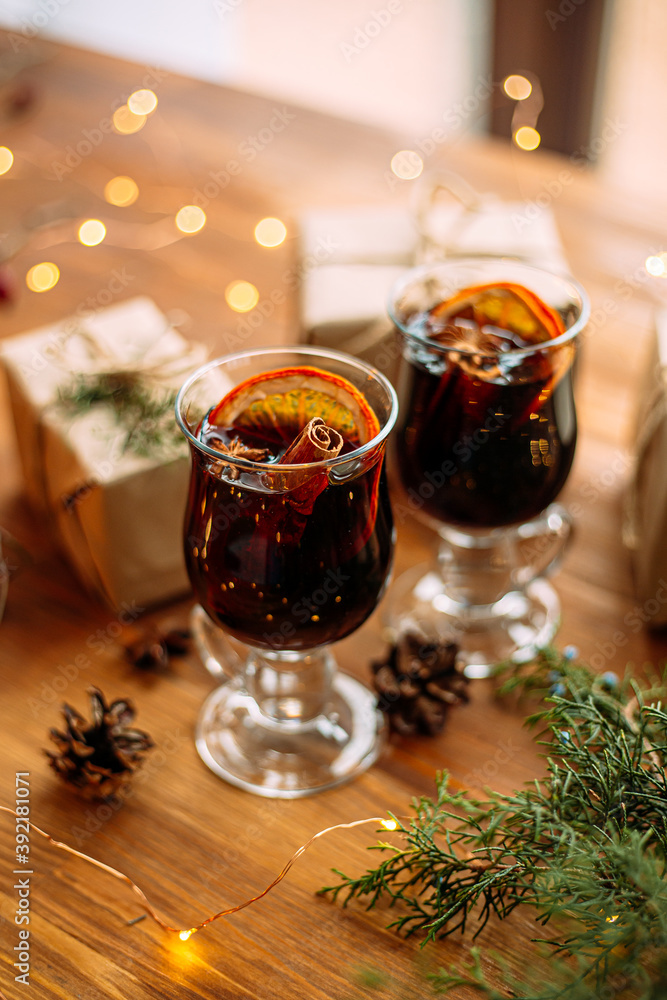 Two glass mugs of glintwine with craft presents