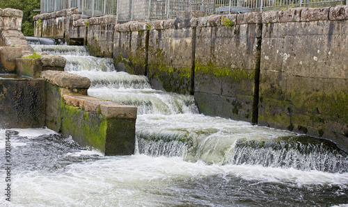 Fish ladder at Lopwell Dam, a weir on the River Tavy, Devon, England, UK. photo