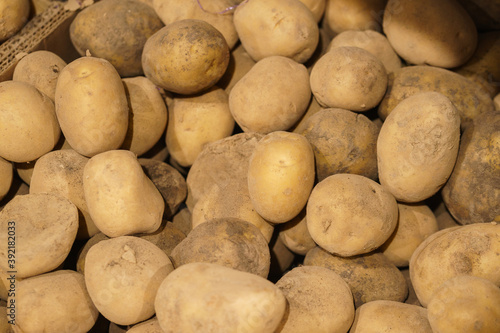 Fresh potatoes on the counter top view close-up.