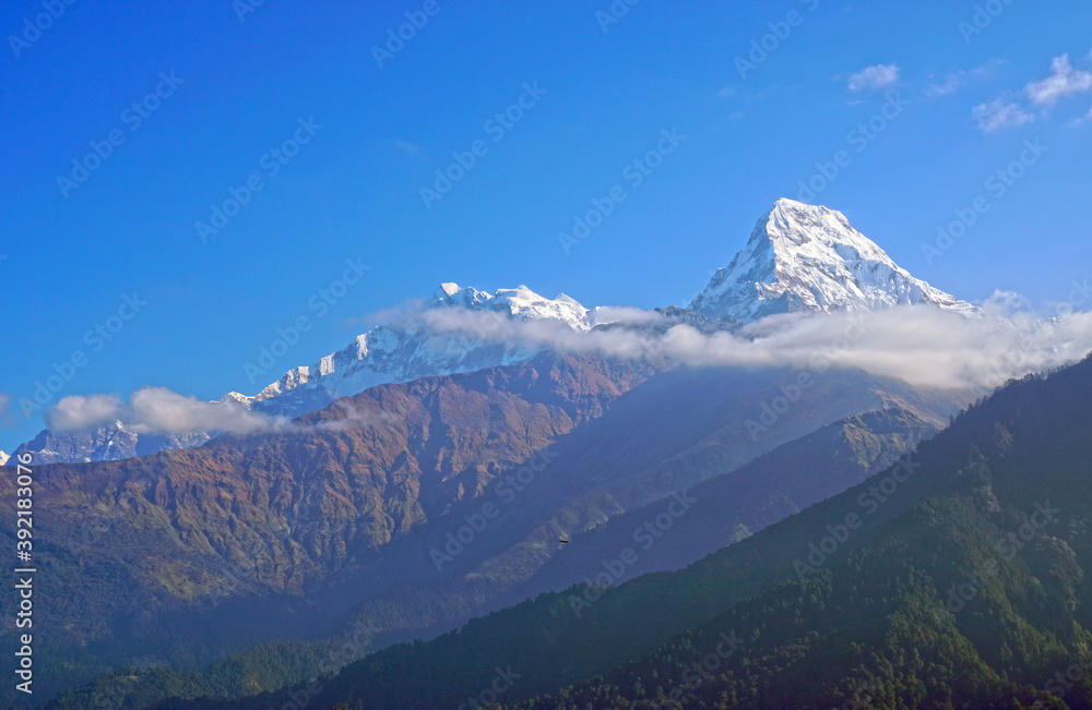 Nature Scene of Top of Mt. Machapuchare is a mountain in the Annapurna Himalayas of north central Nepal seen from Poon Hill, Nepal - trekking route to ABC - Adventure Backpacking outdoor 