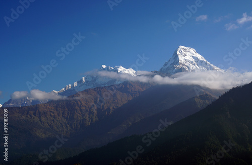 Nature Landscape of Top of Mt. Machapuchare is a mountain in the Annapurna Himalayas of north central Nepal seen from Poon Hill, Nepal - trekking route to ABC - Adventure Backpacking outdoor 