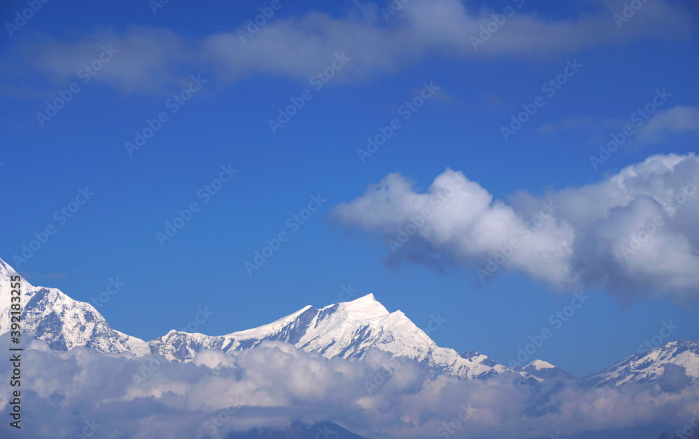 Mt. Dhaulagiri massif with sunrise on himalaya rang mountain in the morning seen from Poon Hill, Nepal - Blue Nature view background and Trekking - hikes to epic mountains and adventurous backpacking Mt. Dhaulagiri massif with sunrise on himalaya rang mountain in the morning seen from Poon Hill, Nepal - Blue Nature view background and Trekking - hikes to epic mountains and adventurous backpacking