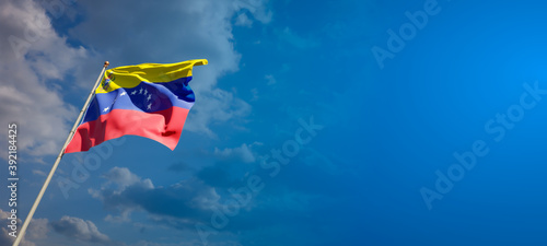 Beautiful national state flag of Venezuela with blank space. Venezuela flag on wide background with place for text 3D artwork.
