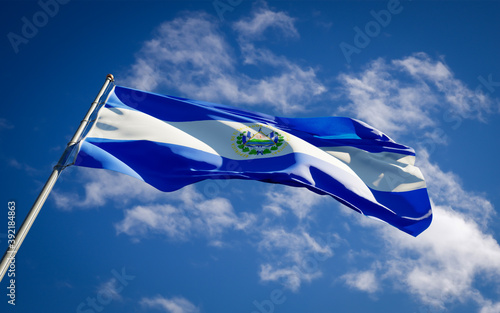 Beautiful national state flag of El Salvador fluttering at sky background. Low angle close-up El Salvador flag 3D artwork.