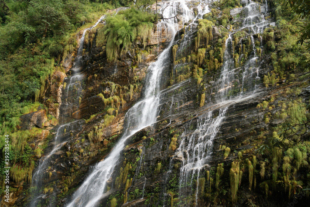 Beautiful waterfall on the way trekking to Annapurna base camp - green natural scene at annapurna national park Nepal Beautiful waterfall on the way trekking to Annapurna base camp - green natural scene at annapurna national park Nepal