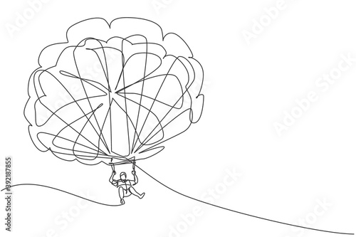Single continuous line drawing of young tourist man flying with parasailing parachute on sky pulled by a boat. Extreme vacation holiday sport concept. Trendy one line draw design vector illustration
