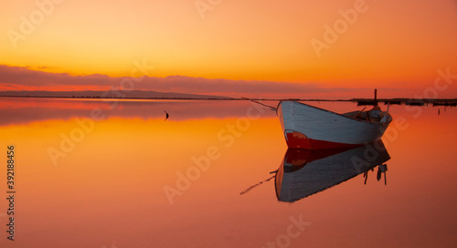 Boat in the water. Fishing boat in the calm waters of the pond of santa caterina in southern sardinia
 photo