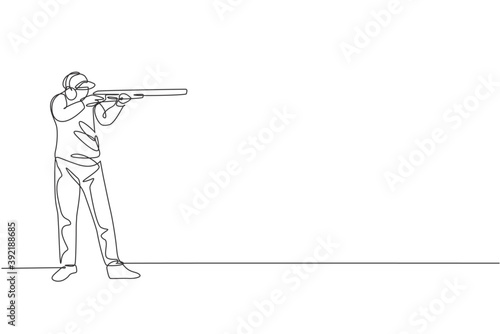 One single line drawing of young man practicing to shot target in range on shooting training ground vector illustration graphic. Clay pigeon shooting sport concept. Modern continuous line draw design