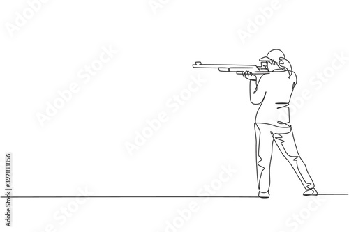 One single line drawing young woman practicing to shot target in range on shooting training ground vector graphic illustration. Clay pigeon shooting sport concept. Modern continuous line draw design