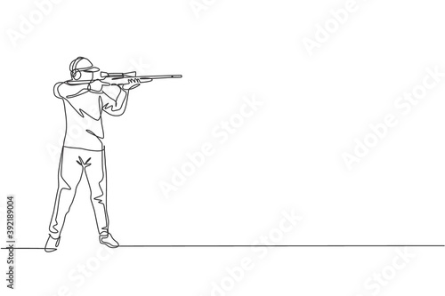 One single line drawing of young man practicing to shot target in range on shooting training ground vector illustration graphic. Clay pigeon shooting sport concept. Modern continuous line draw design