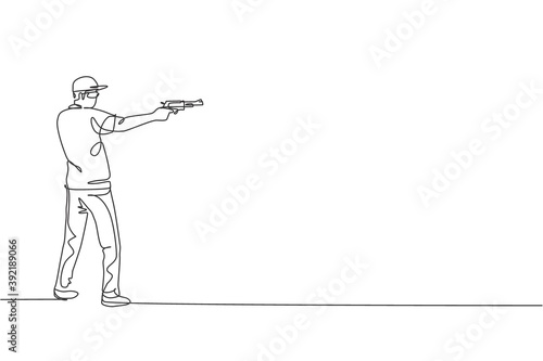 One single line drawing of young man practicing to shot target in range on shooting training ground vector graphic illustration. Clay pigeon shooting sport concept. Modern continuous line draw design