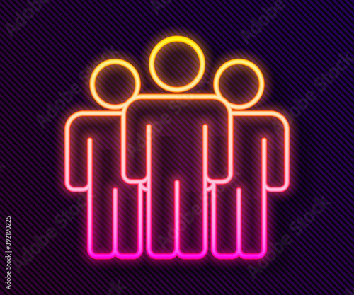 Glowing neon line Users group icon isolated on black background. Group of people icon. Business avatar symbol - users profile icon. Vector.