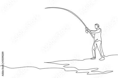 One continuous line drawing of young happy fisherman standing and fishing a fish at the riverside. Fishing leisure hobby vacation concept. Dynamic single line draw design vector graphic illustration