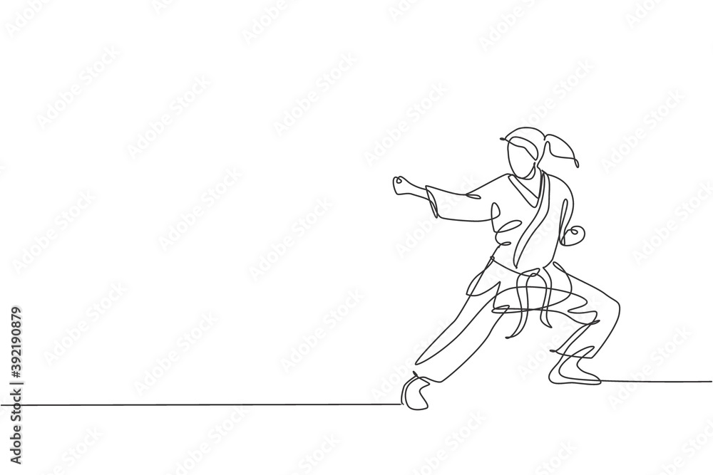 Fototapeta premium One single line drawing of young sporty karateka girl in fight uniform with belt exercising martial art at gym vector illustration. Healthy sport lifestyle concept. Modern continuous line draw design