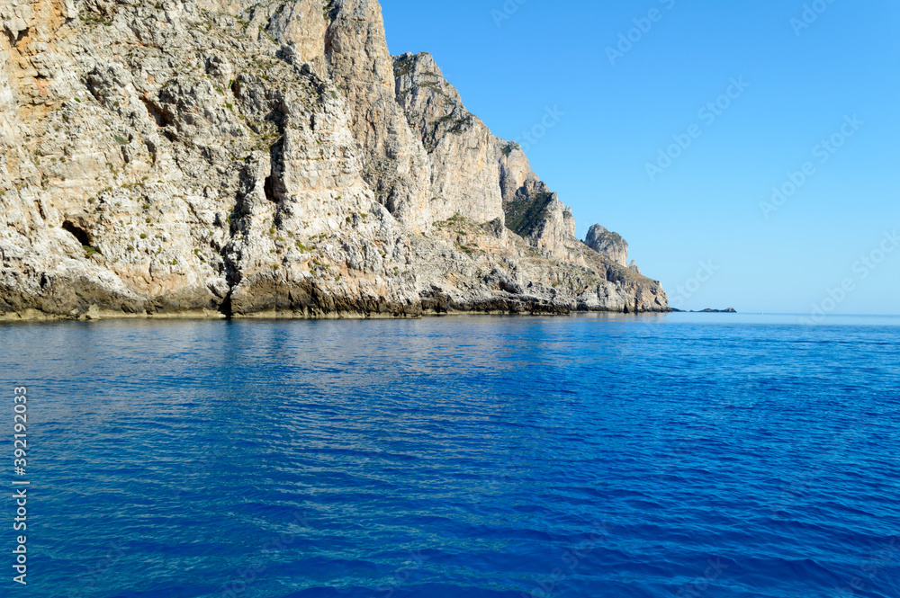 Incredibly bright blue ocean water in marine preserved area of the island Marettimo in Italy