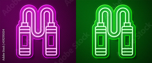 Glowing neon line Jump rope icon isolated on purple and green background. Skipping rope. Sport equipment. Vector.