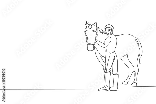 One continuous line drawing of young horse rider man rubbing and stroking horsehair. Equine pet care. Equestrian sport competition concept. Dynamic single line draw design vector graphic illustration