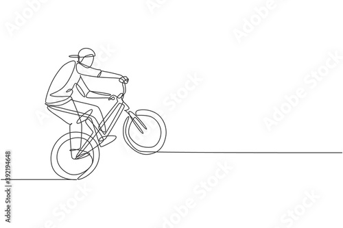 Single continuous line drawing of young BMX cycle rider show extreme risky trick in skatepark. BMX freestyle concept. Trendy one line draw design vector illustration for freestyle promotion media