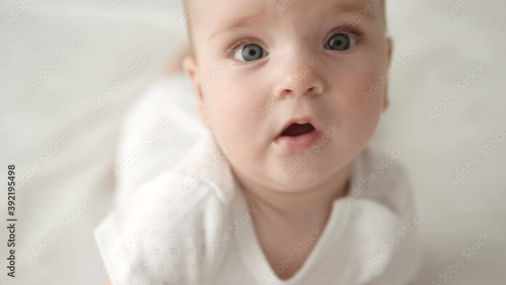 Interested sweet newborn looking at camera curiously, want explore, discover Interested sweet newborn looking at camera curiously, want explore, discover