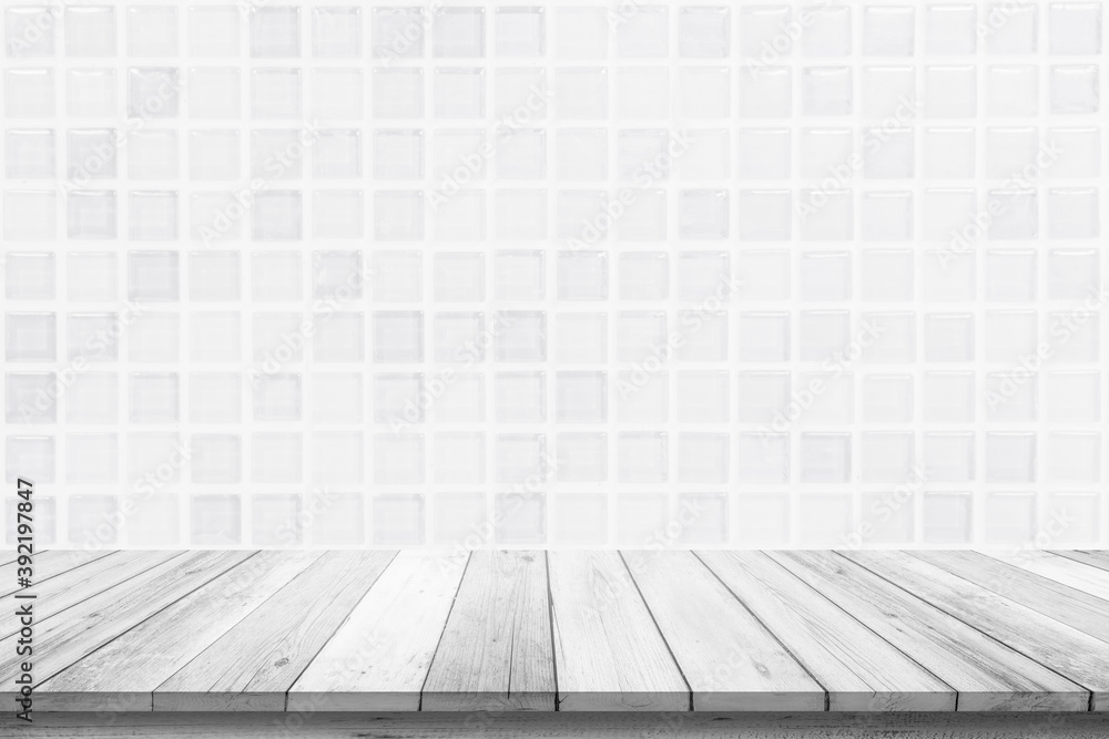 Empty wooden table top on white ceramic tile wall background, Design wood terrace white. Perspective for show space for your copy and branding. Can be used as product display montage. Vintage concept. Empty wooden table top on white ceramic tile wall background, Design wood terrace white. Perspective for show space for your copy and branding. Can be used as product display montage. Vintage concept.