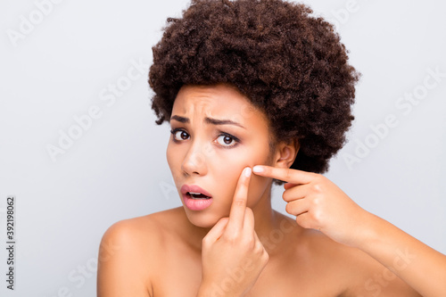 Close-up portrait of her she nice attractive charming worried sad wavy-haired girl touching cheek pimple removing daily wash hygiene isolated on light white gray color pastel background
