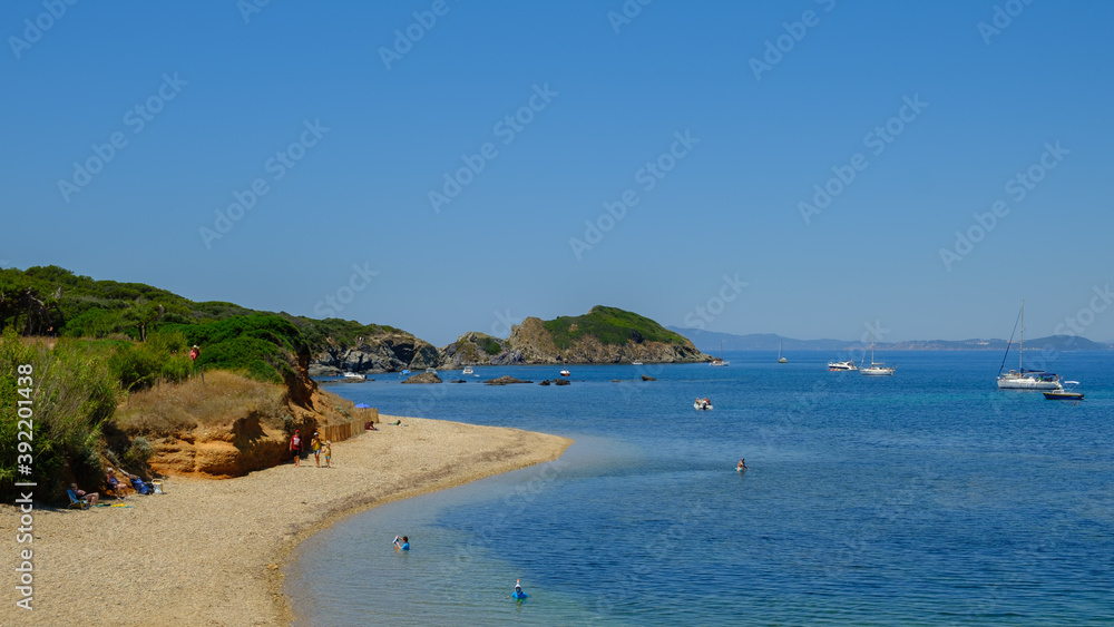 Tourists on a sand Beach at Porquerolles on the French Riviera
