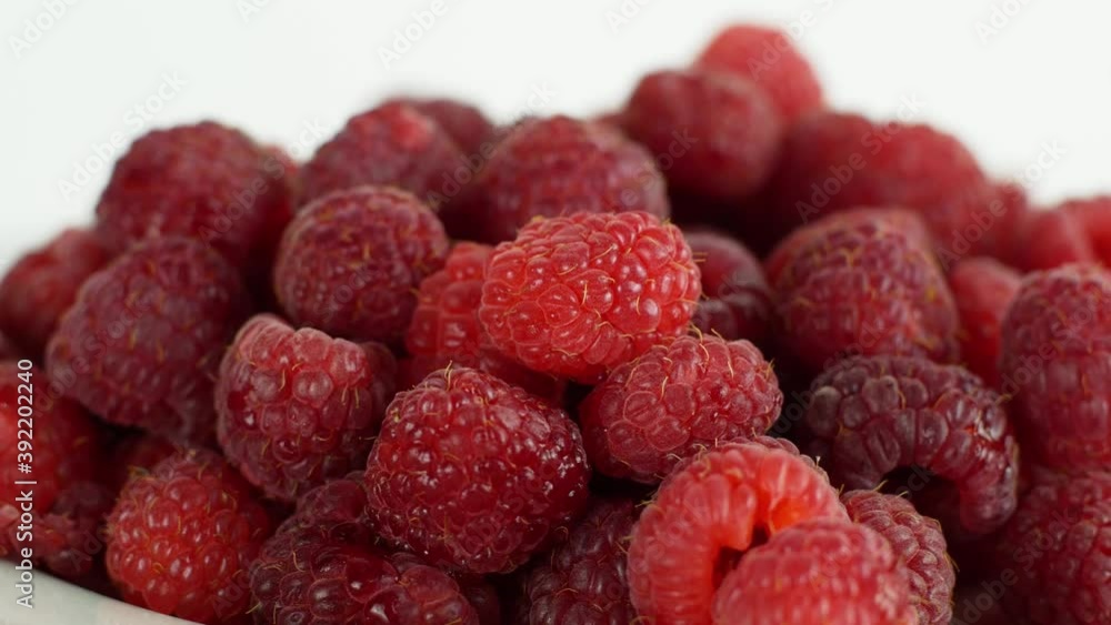 Eco bright colorful berry raspberry rotates 360 on a white background. Close-up of loose raspberry slide 4K video Eco bright colorful berry raspberry rotates 360 on a white background. Close-up of loose raspberry slide 4K video