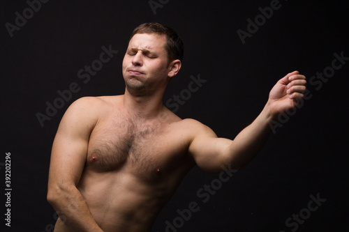 Handsome man in underwear on the black background. Muscular and athletic. Underwear man portrait. Male underwear model in studio