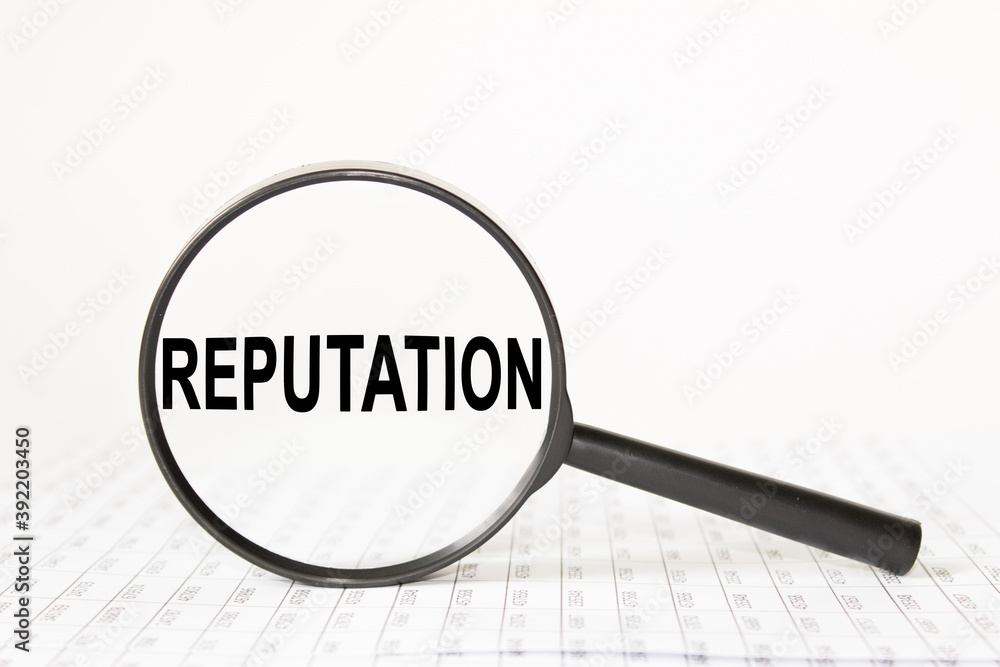 words REPUTATION in a magnifying glass on a white background. business concept words REPUTATION in a magnifying glass on a white background. business concept