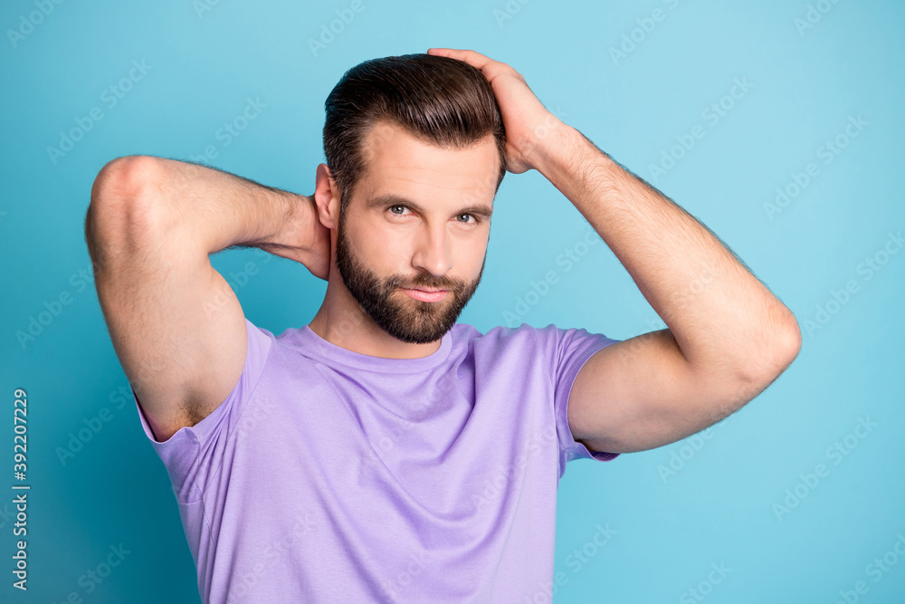 Photo of young handsome man hands touch head enjoy hairdo conditioner isolated over blue color background Photo of young handsome man hands touch head enjoy hairdo conditioner isolated over blue color background