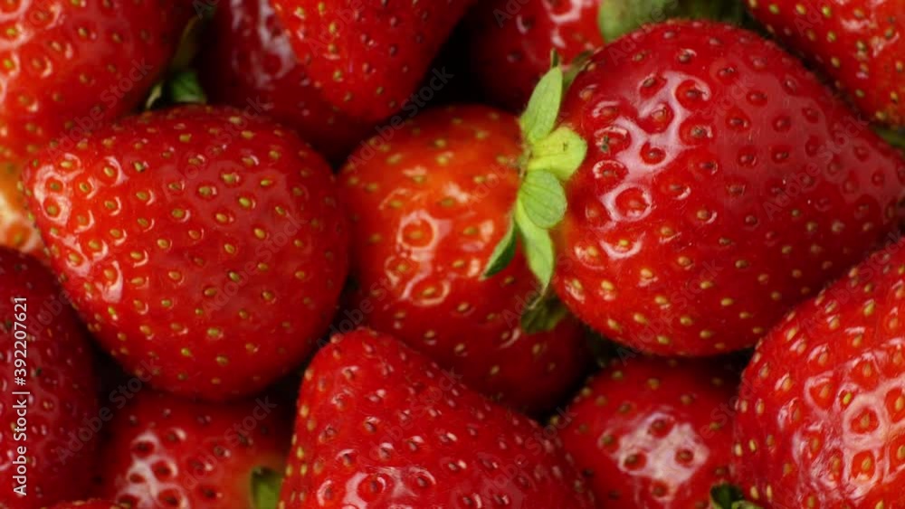 Juicy ripe exotic strawberry rotates on a white background 360. Eco fruits and berries summer. Juicy ripe exotic strawberry rotates on a white background 360. Eco fruits and berries summer.