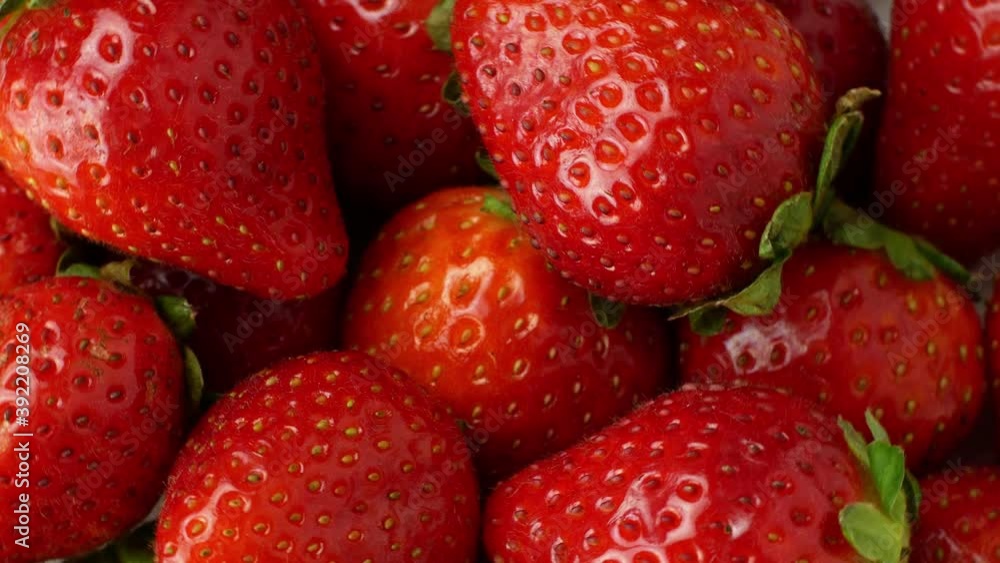 Rotation of juicy strawberries. Top view, Rotation 360 degrees, Extreme close up. Rotation of juicy strawberries. Top view, Rotation 360 degrees, Extreme close up.
