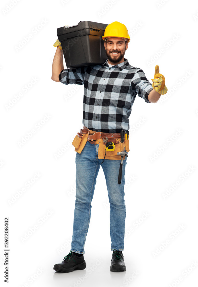 profession, construction and building - happy smiling male worker or builder in helmet with tool box showing thumbs up over white background
