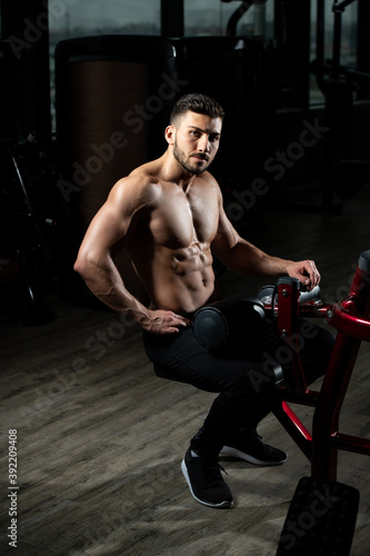 Attractive Young Man Resting In Gym Afther Exercise
