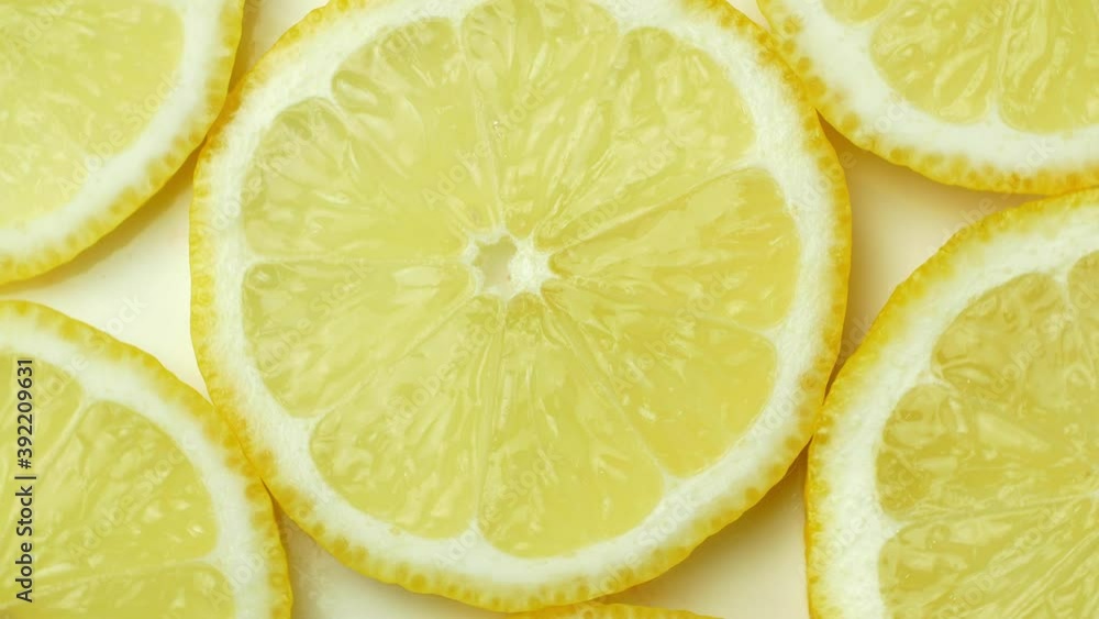 Rotation of a juicy yellow lemon. Top view, 360 degree rotation, close-up of a lemon in a cut.