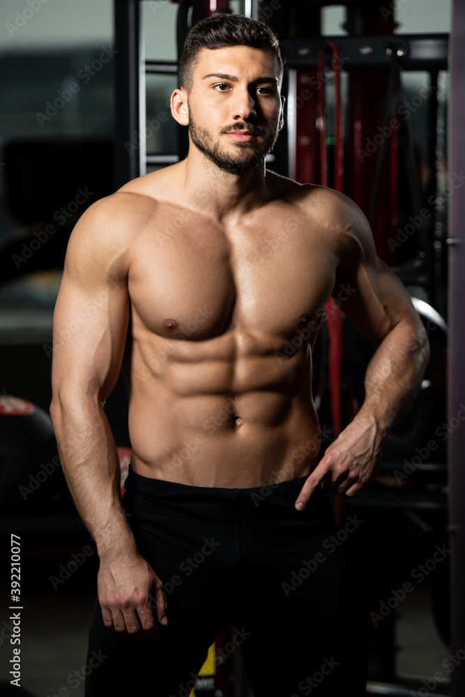 Serious Bodybuilder Standing in the Gym Serious Bodybuilder Standing in the Gym
