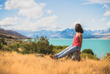 Woman looking to the mountain in New Zealand, 