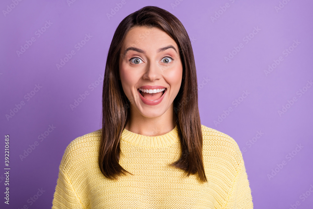 Photo portrait of surprised amazed female student wearing casual outfit smiling isolated on bright color purple background Photo portrait of surprised amazed female student wearing casual outfit smiling isolated on bright color purple background
