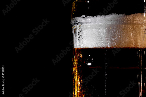 Wallpaper Mural Large glass mug of beer on dark background  Torontodigital.ca