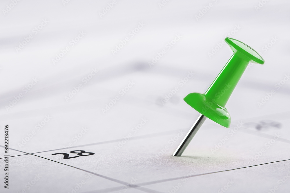 Important date and calendar appointment. Green pin on calendar. Important date and calendar appointment. Green pin on calendar.