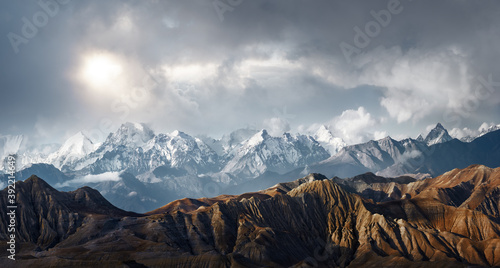 Panoramic view of the scenic landscape of snowy mountains and dramatic clouds © soft_light