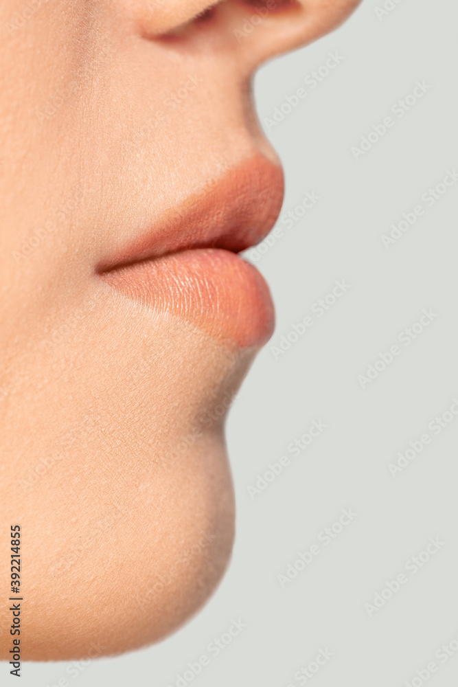 Obraz premium Lips. Close up portrait of beautiful jewish female model. Parts of face and body. Beauty, fashion, skincare, cosmetics, wellness concept. Copyspace. Well-kept skin, fresh look, details.