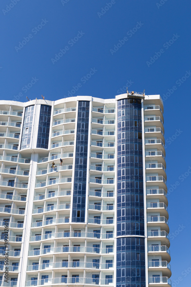 Constructing skyscraper over blue sky, modern architecture. Constructing skyscraper over blue sky, modern architecture.