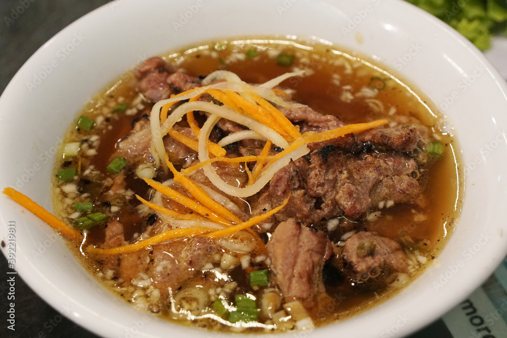 Vietnam food - Bun Cha – Vietnamese Grilled Pork with Noodle and sweet sauce with deep fried spring rolls at Pho xua Hoi an vietnam Vietnam food - Bun Cha – Vietnamese Grilled Pork with Noodle and sweet sauce with deep fried spring rolls at Pho xua Hoi an vietnam