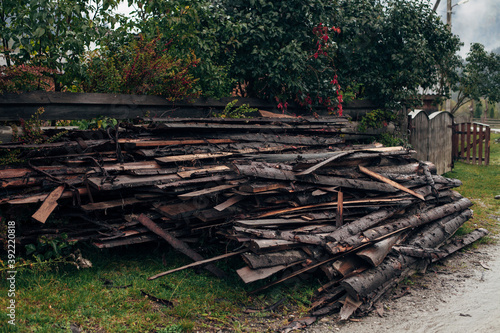 Fototapeta Naklejka Na Ścianę i Meble -  cut firewood in the fall near the house
