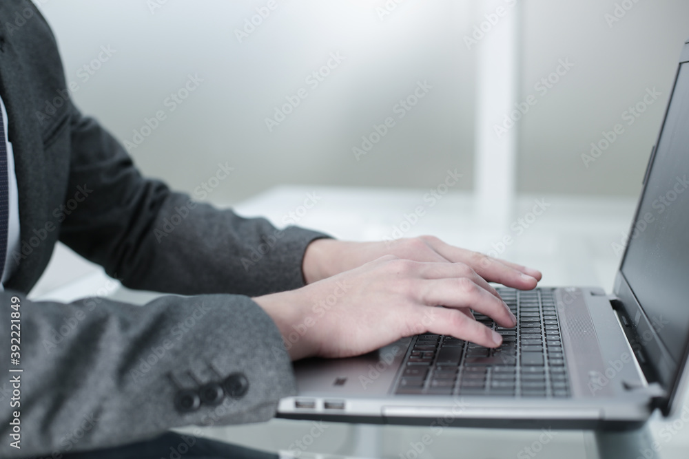 The manager works at the computer in the office The manager works at the computer in the office