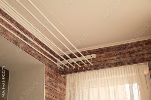 A ceiling linen drayer hanger in the interior of the room photo
