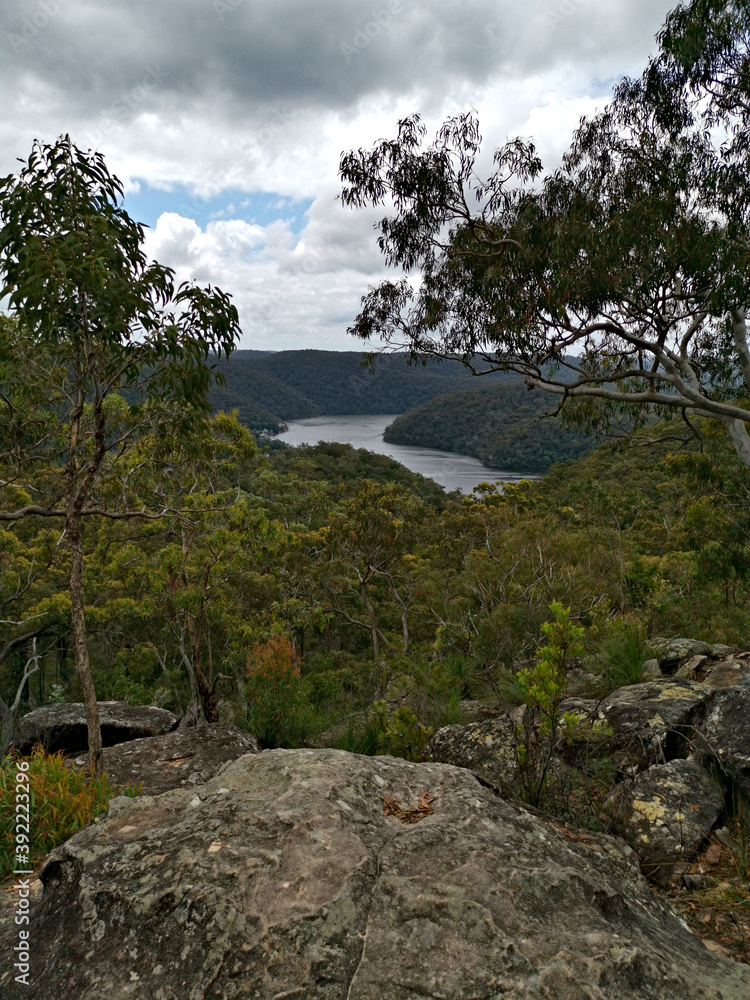 Beautiful view of mountain, valley and creek landscape on a cloudy day, Berowra Heights, Berowra Valley National Park, Sydney, New South Wales, Australia
