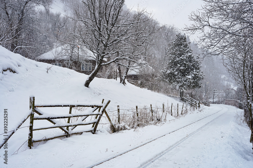Naklejka premium Winter landscape in Romania, railroad covered with snow